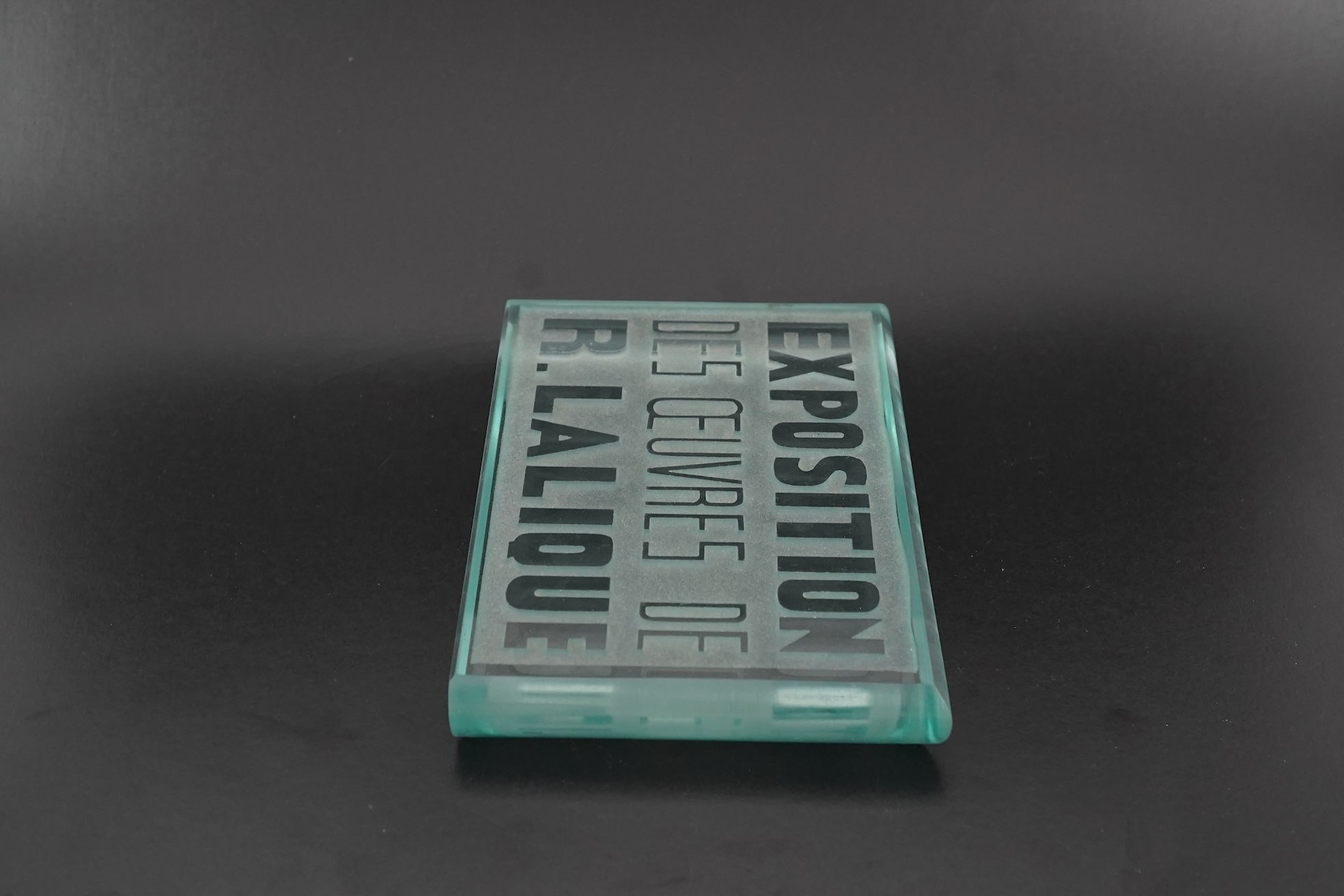 Lalique: A glass advertising plaque 'EXPOSITION DES ŒUVRES DE R.LALIQUE'